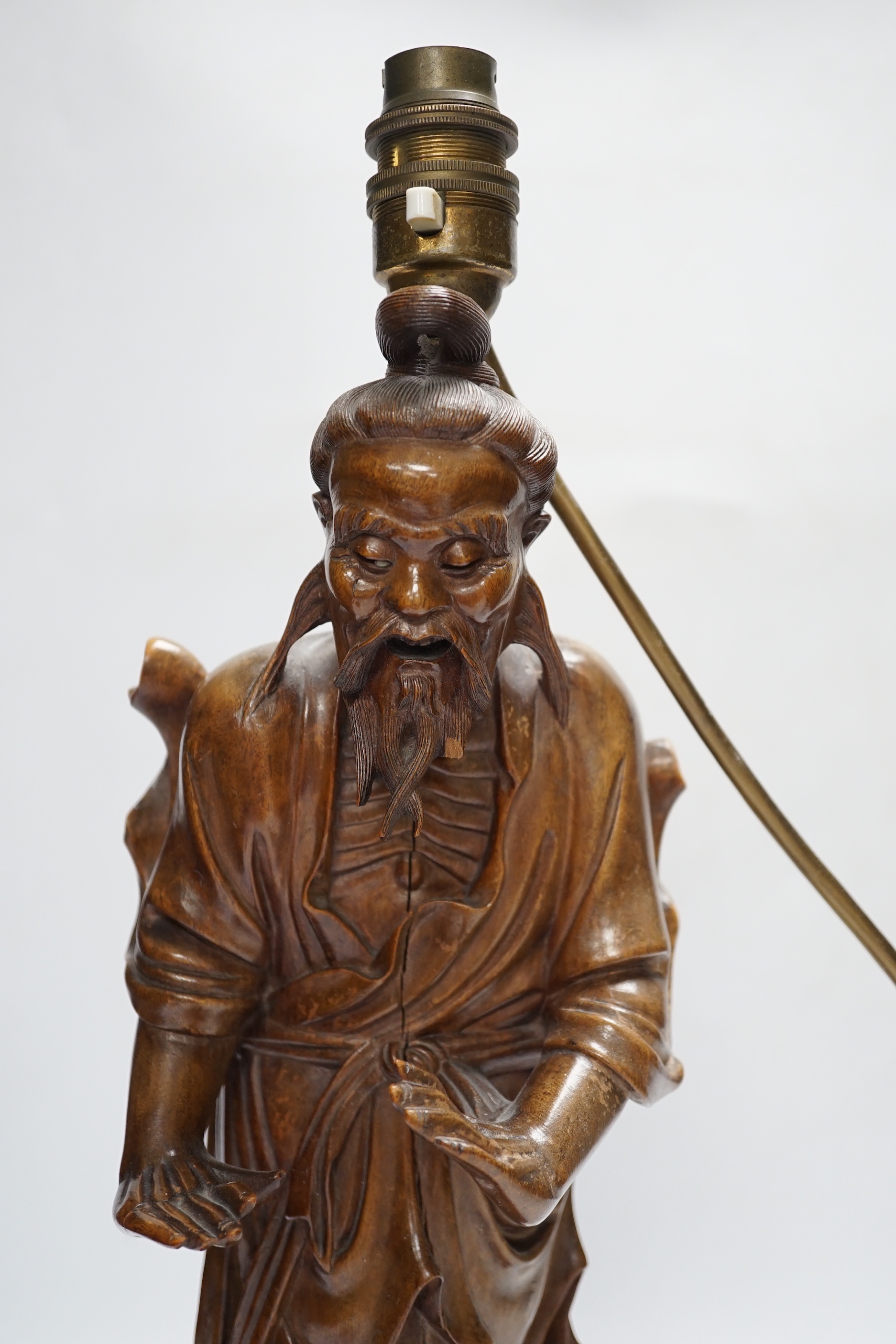 A Chinese carved wood figural table lamp, 43cm total